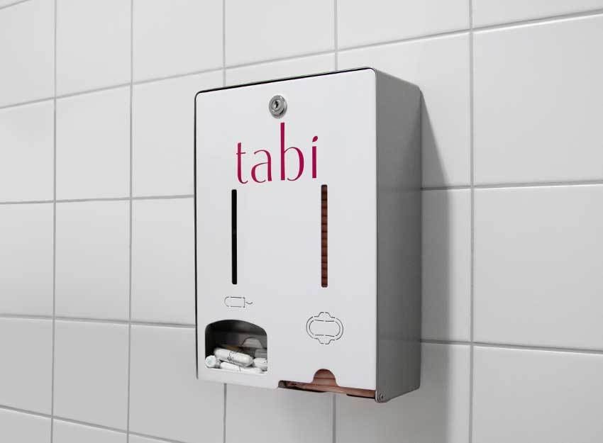 tabi Tampon- und Bindenspender hängt an einer Sanitäranlagen-Wand